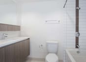 Thumbnail 40 of 49 - A white toilet sits next to a white sink in a bathroom. at The View, Los Angeles