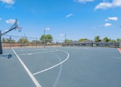 Thumbnail 3 of 18 - the basketball court is equipped with a basketball hoop and a fence