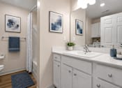 Thumbnail 34 of 42 - A bathroom with toilet, shower, white cabinets and countertop.