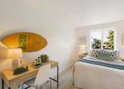 Thumbnail 3 of 39 - a bedroom with a surfboard on the wall
