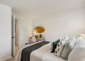 Thumbnail 25 of 39 - a bedroom with a bed and desk in a 555 waverly unit