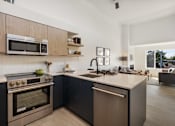 Thumbnail 6 of 39 - a kitchen and living room in a 555 waverly unit
