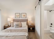 Thumbnail 17 of 39 - a bedroom with a bed and two night stands