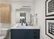 Thumbnail 31 of 39 - a bathroom with a sink and a toilet