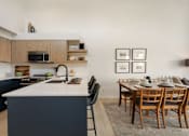 Thumbnail 26 of 39 - a kitchen and dining area in a 555 waverly unit