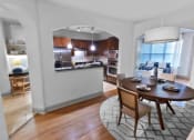 Thumbnail 16 of 27 - Kitchen and Dining Area with Round Table at The Estates at Ballantyne, Charlotte, NC, 28277