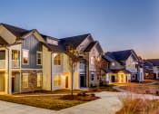 Thumbnail 24 of 24 - exterior building at dusk at Creekside at Providence, Tennessee