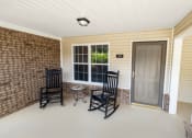 Thumbnail 21 of 31 - a front porch with rocking chairs and a small table