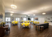 Thumbnail 9 of 31 - a large room with tables and chairs with yellow table cloths