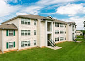 Thumbnail 11 of 13 - A large apartment building with a green lawn in front. at The Dawson Cartersville in Cartersville, GA 30191