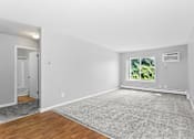 Thumbnail 3 of 9 - an empty living room at Eagle Pointe New London, CT