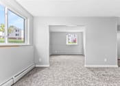 Thumbnail 4 of 9 - the living room and dining room at Eagle Pointe New London