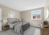 Thumbnail 5 of 12 - A bedroom with a large bed and a window overlooking a red house at Rose Hill Estates, Norwich, CT, 06360
