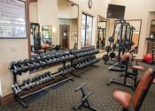 Thumbnail 21 of 34 - Fitness Center With Updated Equipment at Dominion Courtyard Villas, Fresno, California