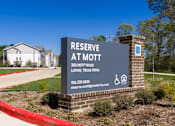 Thumbnail 7 of 22 - A sign for Reserve at Mott in Lufkin, Texas.