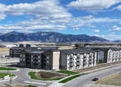 Thumbnail 1 of 36 - an aerial view of an apartment complex with mountains in the background at Yellowstone Landing, Belgrade, MT