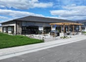 Thumbnail 11 of 36 - a building with a porch and a street in front of it at Yellowstone Landing, Belgrade, Montana