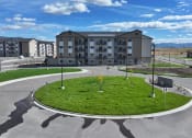 Thumbnail 2 of 36 - an empty parking lot with an apartment building in the background at Yellowstone Landing, Montana, 59714