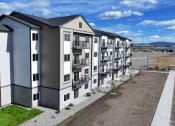 Thumbnail 5 of 36 - an aerial view of an apartment building on a city street at Yellowstone Landing, Belgrade, MT