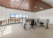 Thumbnail 24 of 36 - an open office space with desks and chairs and a window at Yellowstone Landing, Belgrade, Montana