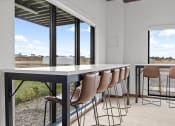 Thumbnail 23 of 36 - a dining table with chairs in front of a large window at Yellowstone Landing, Montana