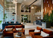 Thumbnail 26 of 26 - A large room with a reception desk and couches.