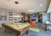 Thumbnail 22 of 26 - a games room with a pool table and a tv