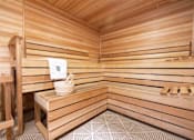 Thumbnail 25 of 26 - a sauna with a wooden bench and a bucket in it