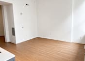 Thumbnail 12 of 14 - Empty living room with wood flooring at Textile Lofts Apartments, Cincinnati, Ohio