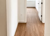 Thumbnail 10 of 14 - Hallway leading to bright windowed room at Textile Lofts Apartments, Ohio