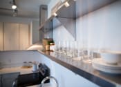 Thumbnail 14 of 33 - glasses and plates on shelf at 747 Apartments, Indiana