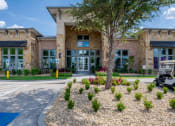 Thumbnail 5 of 43 - a building with a golf cart parked in front of it at Discovery at Craig Ranch, McKinney, TX, 75070