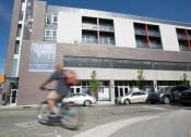 Thumbnail 26 of 33 - exterior of apartment building with bicycler at 747 Apartments, Indiana, 46202