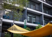 Thumbnail 24 of 52 - courtyard with hammock at Pinnex, Indianapolis, Indiana