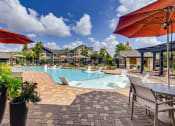 Thumbnail 27 of 29 - Pool seating and sun deck at Avenues at Shadow Creek Ranch, Pearland, TX, 77584