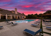 Thumbnail 1 of 27 - swimming pool with clubhouse in the background at sunset  at Butternut Ridge, North Olmsted, OH