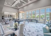Thumbnail 3 of 43 - a gathering room with tables and chairs and large windows at Discovery at Craig Ranch, Texas