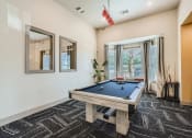 Thumbnail 15 of 84 - clubhouse with billiard table and large windows letting in natural light  at Grand Villas Apartments, Texas
