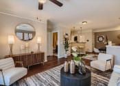 Thumbnail 69 of 84 - a living room with a couch and a table  at Grand Villas Apartments, Katy, TX, 77494