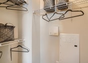 Thumbnail 83 of 84 - a laundry room with a clothes rack and a dryer  at Grand Villas Apartments, Texas, 77494
