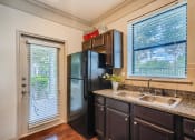 Thumbnail 55 of 84 - kitchen with patio door and sunny window  at Grand Villas Apartments, Katy, Texas