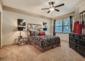 Thumbnail 61 of 84 - a bedroom with ceiling fan and walk-in closet  at Grand Villas Apartments, Texas, 77494