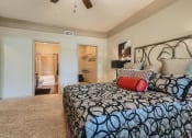 Thumbnail 70 of 84 - a bedroom with a bed and a closet  at Grand Villas Apartments, Katy, Texas