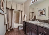Thumbnail 71 of 84 - a bathroom with a sink and a toilet  at Grand Villas Apartments, Texas, 77494