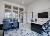 Thumbnail 22 of 43 - a conference room with a table and chairs and a television at Discovery at Craig Ranch, McKinney, 75070