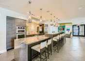 Thumbnail 24 of 24 - a large kitchen with granite countertops and stainless steel appliances at Imperial Lofts, Sugar Land, 77498