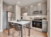 Thumbnail 5 of 65 - Kitchen Area with Stainless Steel Appliances at Marquee, Minneapolis, MN, 55403