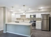 Thumbnail 17 of 30 - Fully Equipped Kitchen at Springhill Apartments, Overland Park, KS