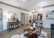 Thumbnail 2 of 61 - Living Room with Wooden Coffee Table at Avenues at Tuscan Lakes, League City, 77573