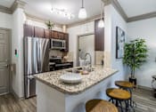 Thumbnail 1 of 61 - Kitchen with Granite Countertops at Avenues at Tuscan Lakes, League City, 77573